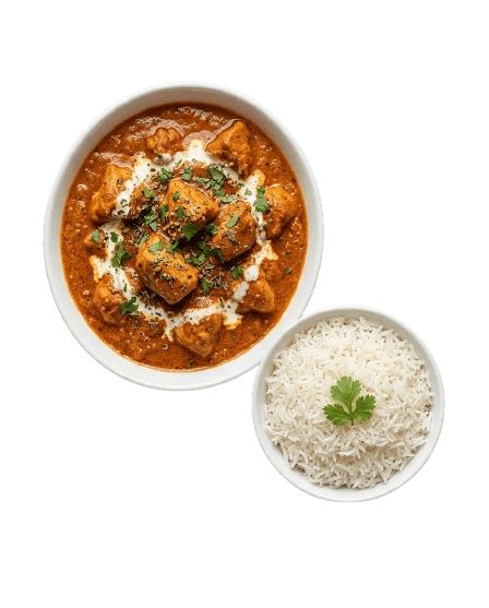 Butter Chicken served with plain rice in white ceramic bowls