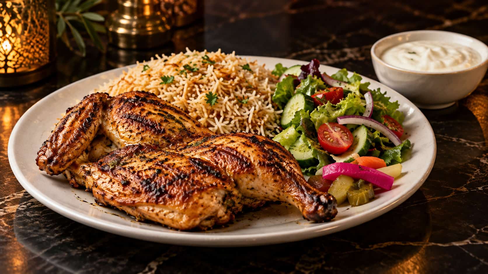 Grilled chicken platter served with Pulao Rice, garlic sauce, salad and pickle at a halal restaurant.